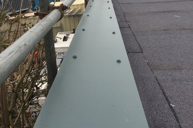 Full spec felt roof with a cap flashing on upstand.