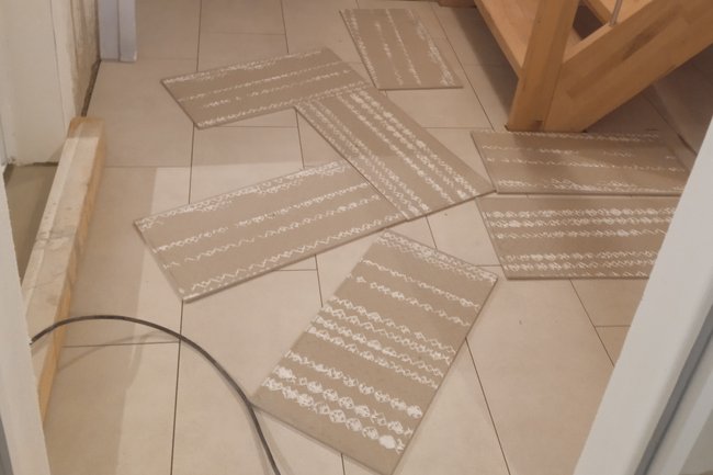 Plattenverlegung in Keller
