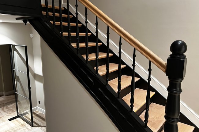 Renovatie van trap in "Amerikaanse" stijl te Schilde