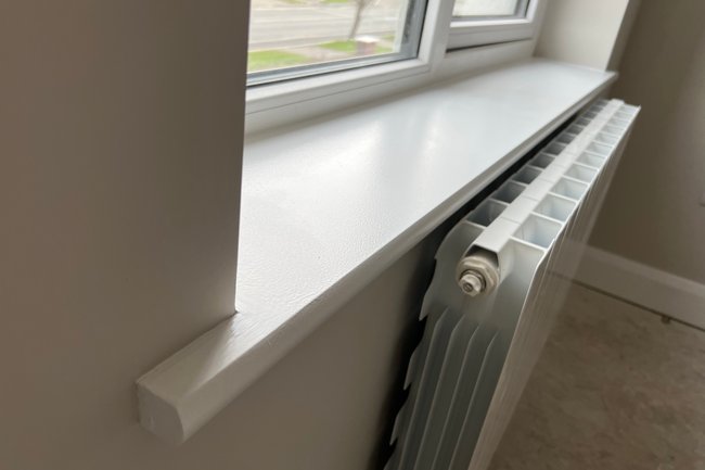 Up close of a window sill freshly painted