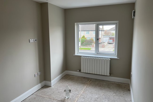 Front bedroom painted in grey and white for skirtings