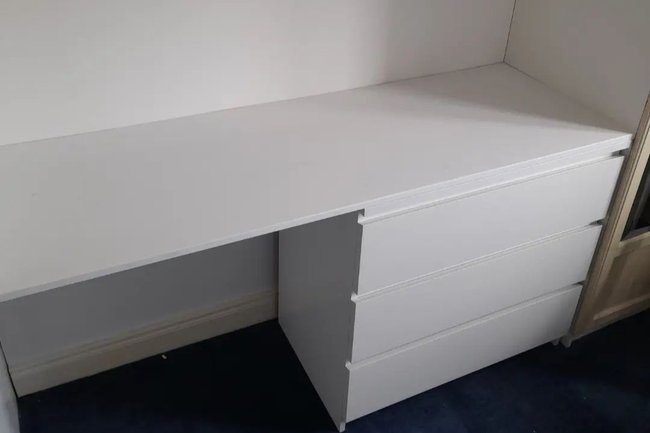 IKEA side locker used to make large built in desk