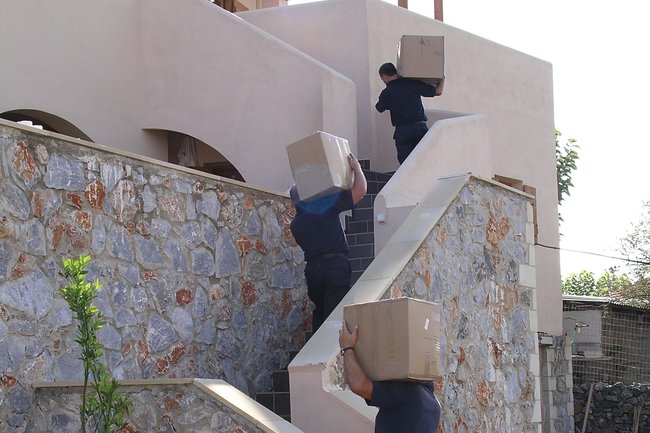 Carrying boxes into our customer's home in Greece