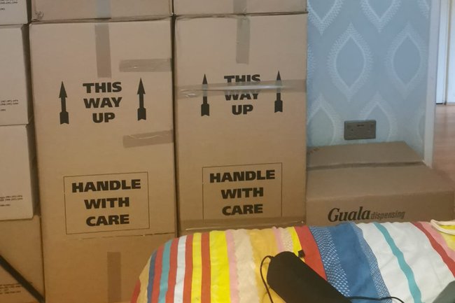 few boxes of goods and garments