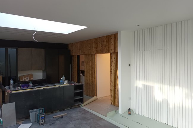 Decorative batten wall with secret doors