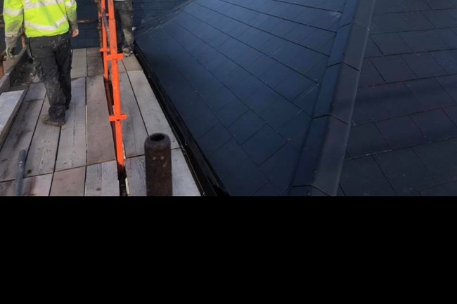 New fiber slate roof installation