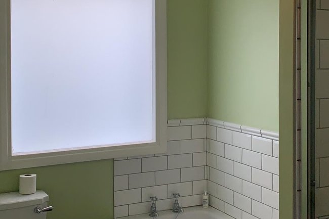 Bathroom repainted walls ceiling and skirting