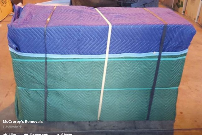 A blanket wrap of a polished piece of furniture for transpor