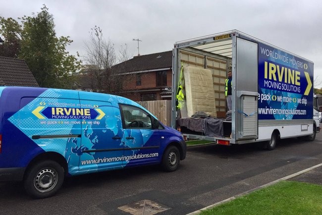 smaller van carrying crew and additional packing to a move