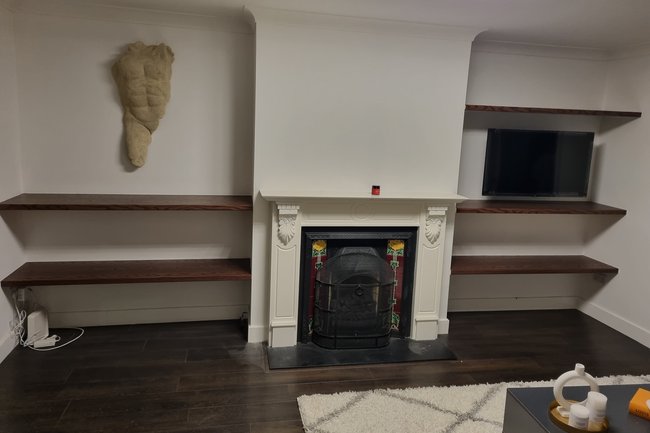 Floating shelves installed, TV hanged ,statues installation