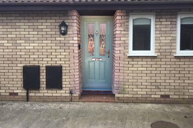 Chartwell Green composite door with Elegance glazing